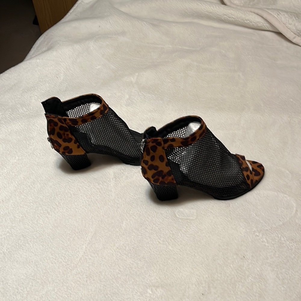 Brand new never worn leopard mini boots with mess